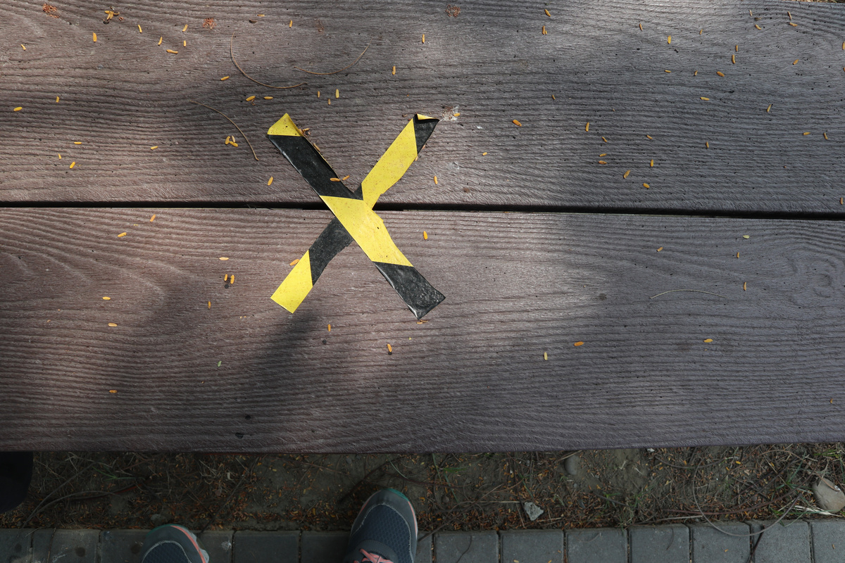 Social Distancing X Sign on the Bench